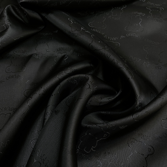 Подкладочная ткань черного цвета с жаккардовой выработкой мишками 438503 Италия 1180 рублей за метр