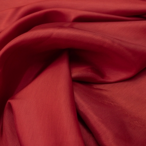 Вискозный костюмно -плательный подклад из брендовых стоковых коллекций. Спокойного красного цвета.