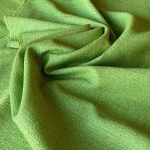 Жаккард из стока Armani и Valentino. Полотно легкое и за счет нейлона в составе хорошо держит форму. Идеальный вариант для пошива летне-весеннего пальто или жакета. Цвет молодой зелени, очень красивый и свежий.