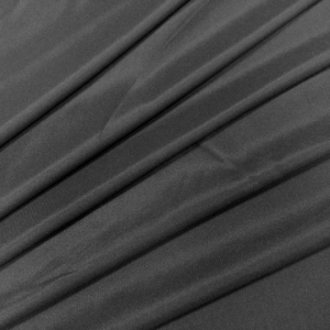 Трикотажная биэластичная клеевая ткань Kufner черного цвета. Используется для проклеивания изделий из трикотажных полотен и биэластичных костюмных и плательных тканей.  Плотность 30 гр.м.кв